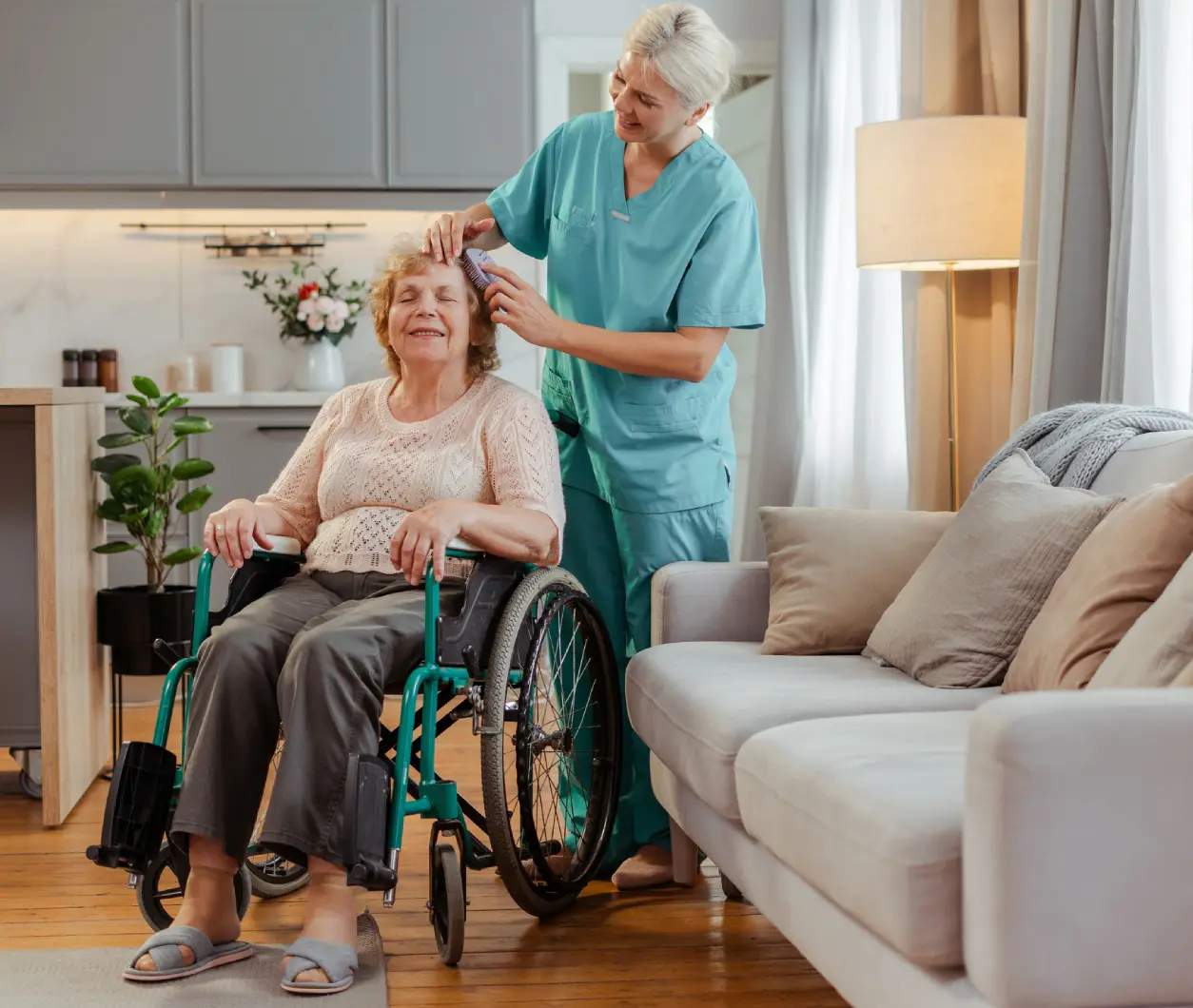 New Project(2) Caregiver assisting elderly woman in wheelchair.